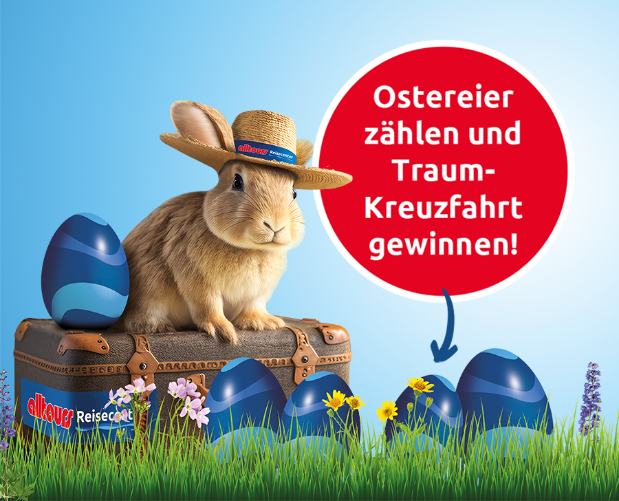Der alltours Hase sitzt auf einem Koffer. Es sind 5 Eier zu sehen.
